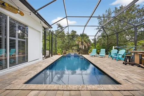 a swimming pool with a outdoor seating