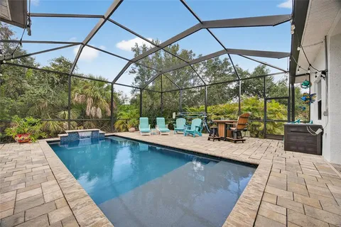 a view of a swimming pool with a lounge chairs