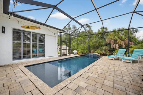 a view of a swimming pool with a patio