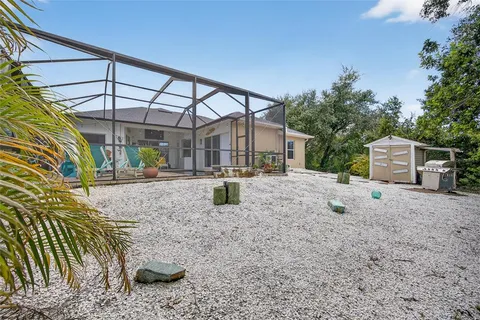 a backyard of a house with a shaded area
