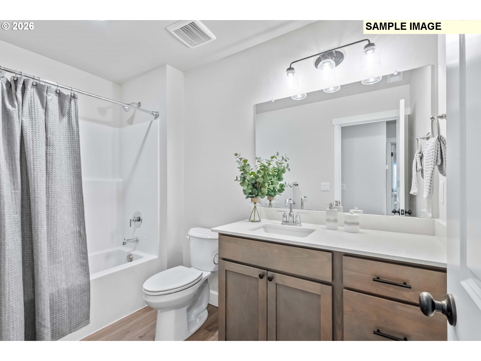 481 Taft Street Umatilla, OR 97882 - Photo 18 of 18 a bathroom with a granite countertop sink toilet a large mirror a shower and a bathtub
