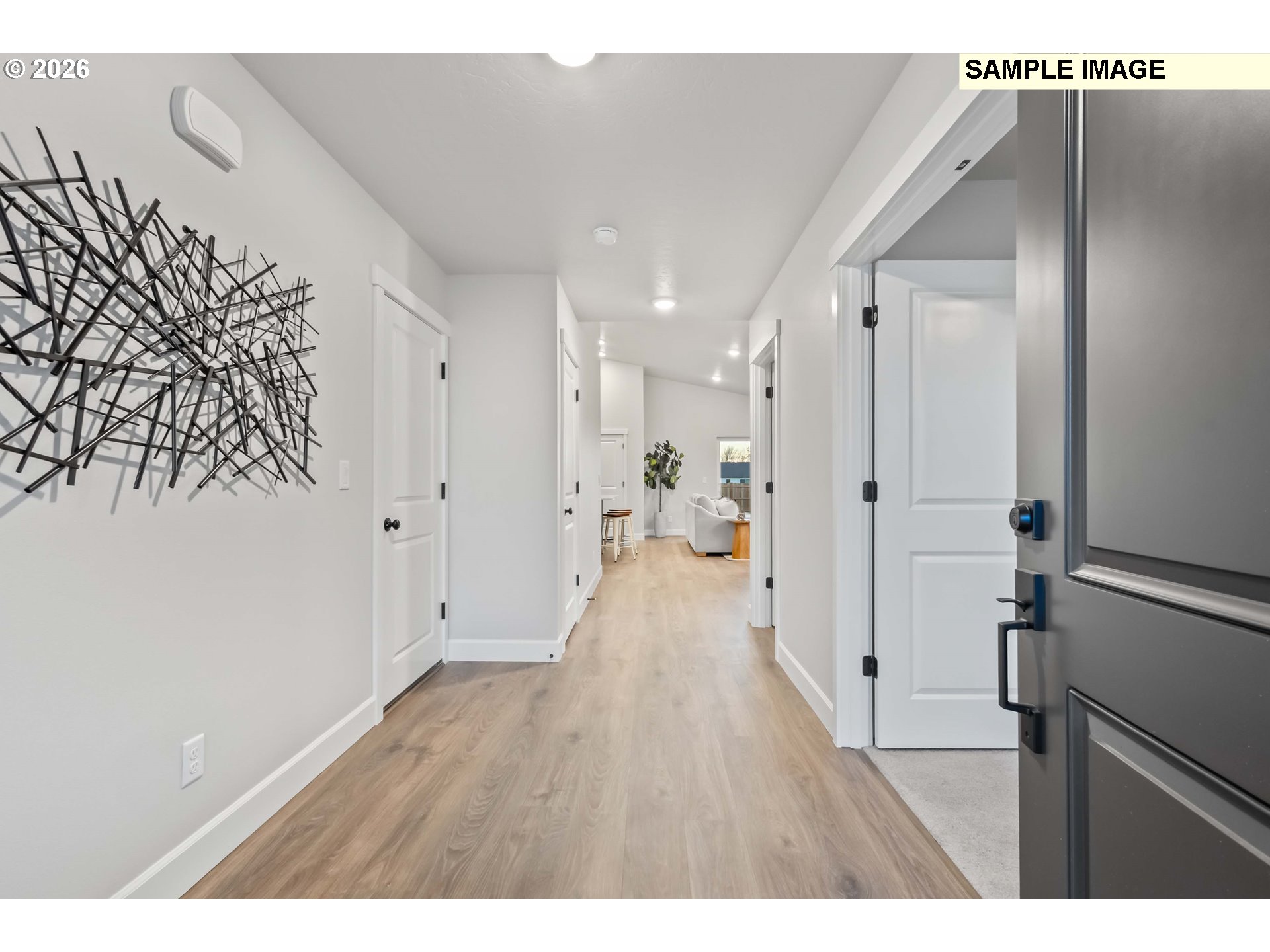 481 Taft Street Umatilla, OR 97882 - Photo 2 of 18 a view of a hallway with wooden floor and a bathroom