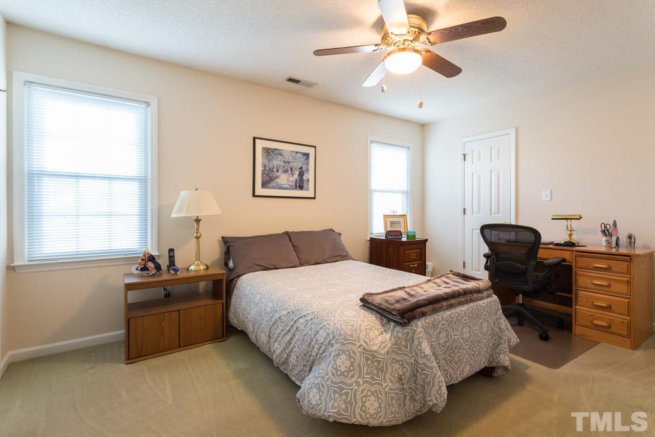 6705 Twin Tree Court Raleigh, NC 27613 - Photo 14 of 20 Second floor bedroom with two closets and private bath.