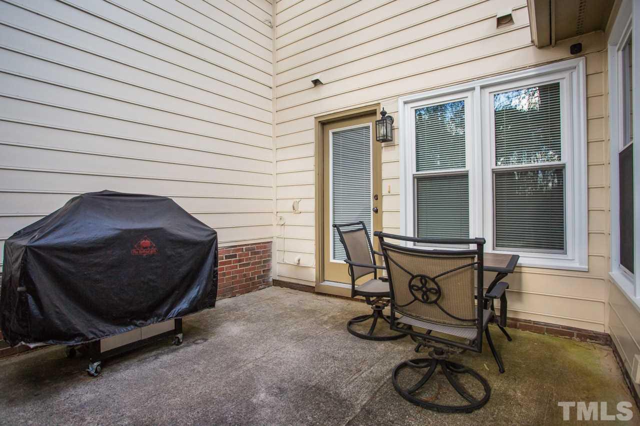 6705 Twin Tree Court Raleigh, NC 27613 - Photo 17 of 20 Patio off the kitchen and family room and leads to common open space in the back!