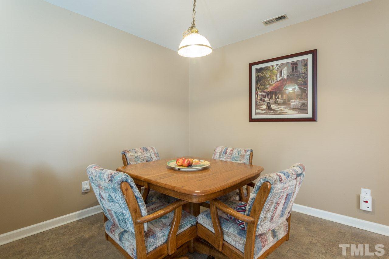 6705 Twin Tree Court Raleigh, NC 27613 - Photo 20 of 20 Open floor plan with dining area open to family room and kitchen.