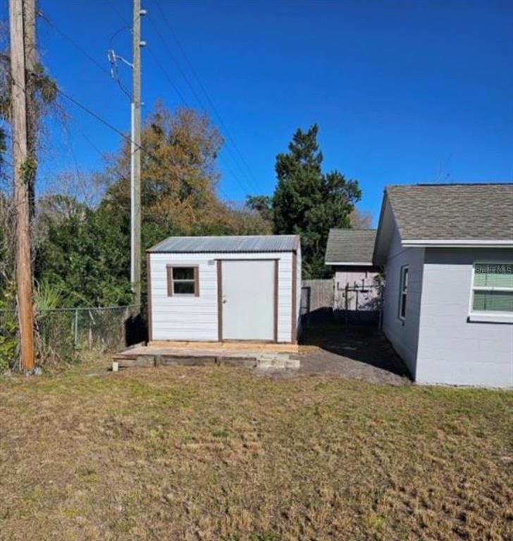 7149 Carmel Avenue New Port Richey, FL 34655 - Photo 13 of 13 a view of a house with a yard