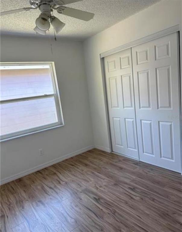 7149 Carmel Avenue New Port Richey, FL 34655 - Photo 9 of 13 wooden floor in an empty room