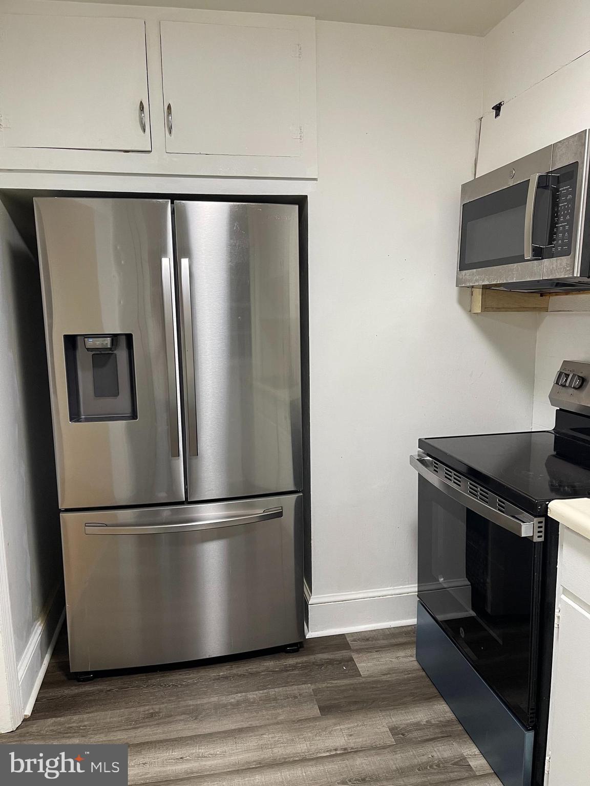 404 Biggs Avenue Frederick, MD 21702 - Photo 8 of 10 a metallic refrigerator freezer sitting in a kitchen