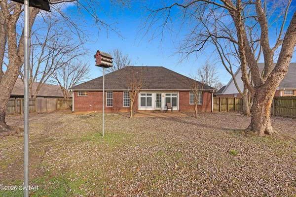 a house with trees in front of it