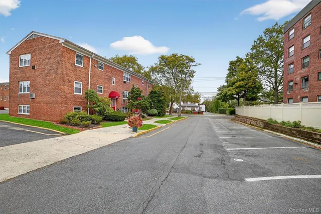 a road view with a building in the background