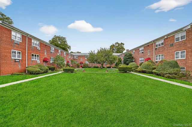 a front view of building with garden