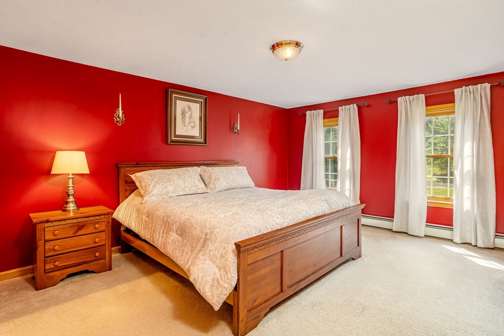 16 Hillside Drive Townsend, MA 01469 - Photo 17 of 35 a spacious bedroom with a bed and a couch