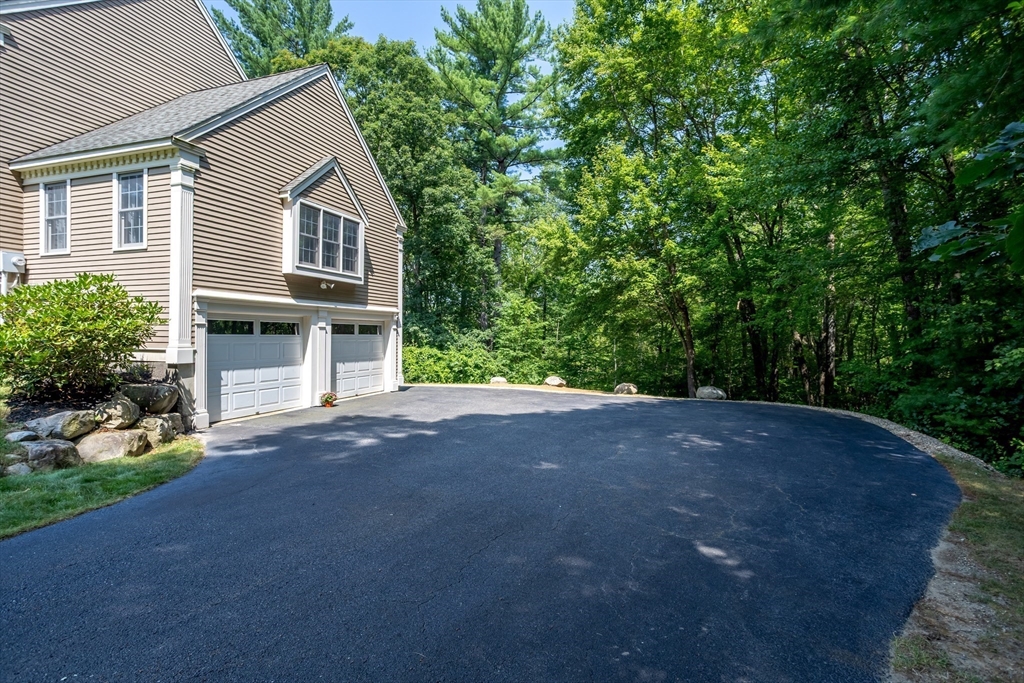 16 Hillside Drive Townsend, MA 01469 - Photo 31 of 35 a view of a house with a yard and plants