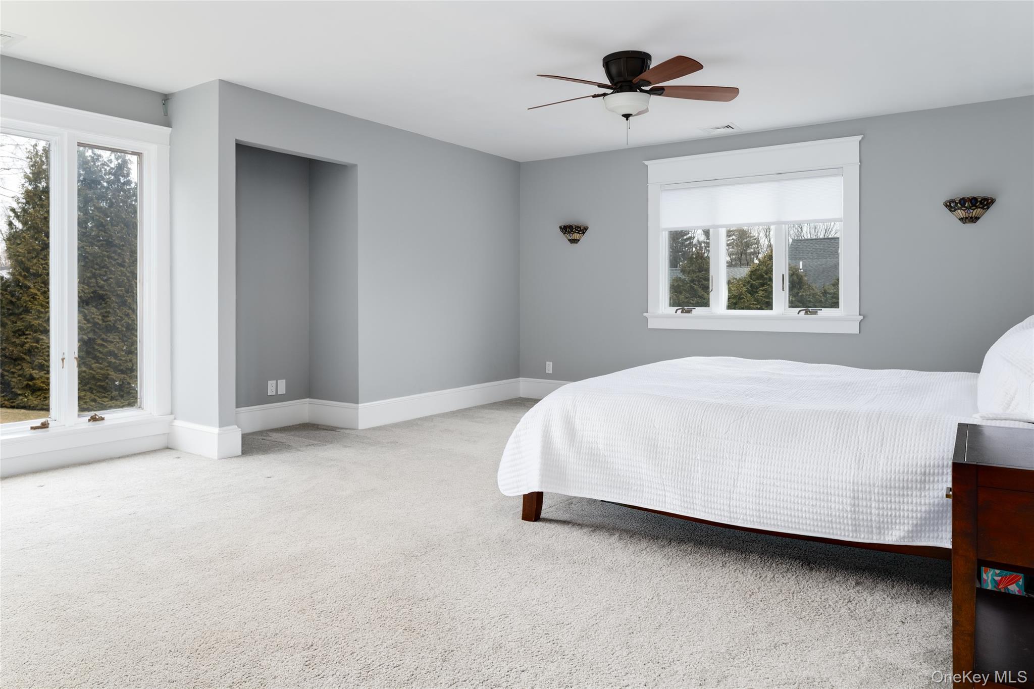 239 Sunny Ridge Road Harrison, NY 10528 - Photo 14 of 33 a large bed sitting in a room next to a window