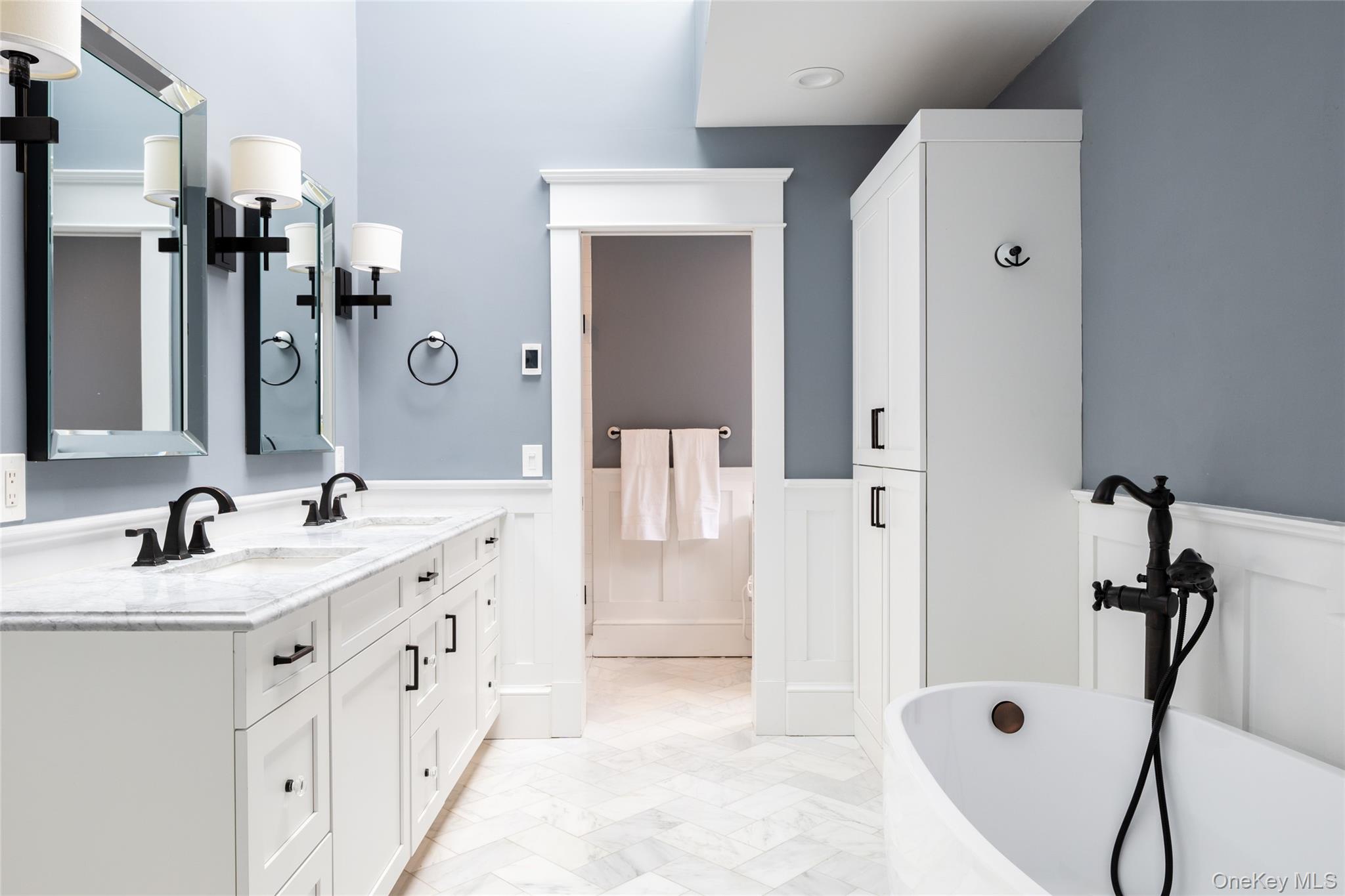 239 Sunny Ridge Road Harrison, NY 10528 - Photo 15 of 33 a bathroom with a double vanity sink a mirror and shower