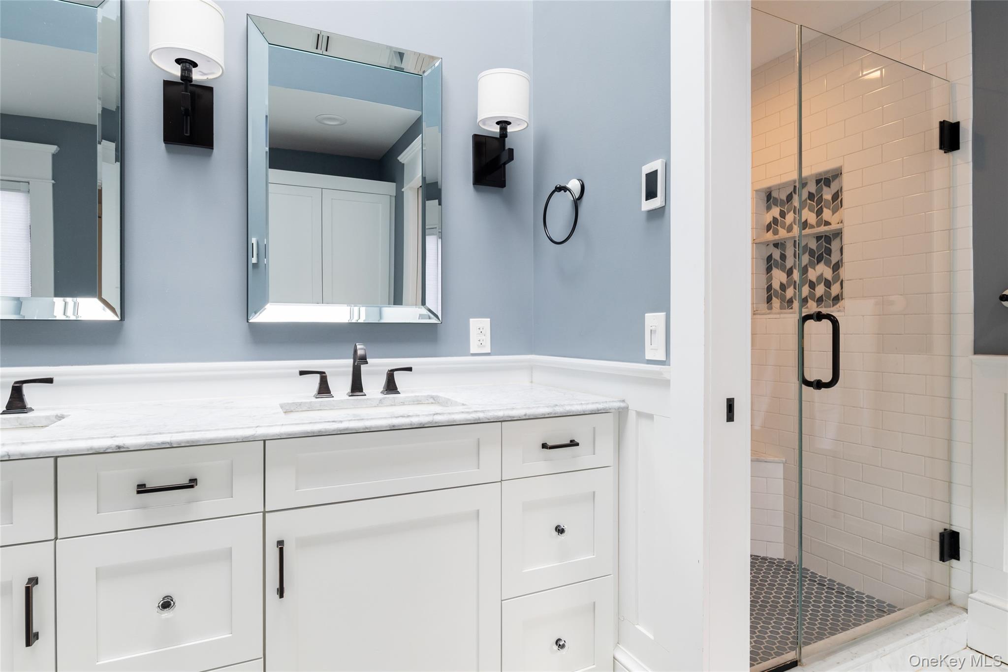 239 Sunny Ridge Road Harrison, NY 10528 - Photo 16 of 33 a bathroom with a sink vanity granite tub shower and mirror