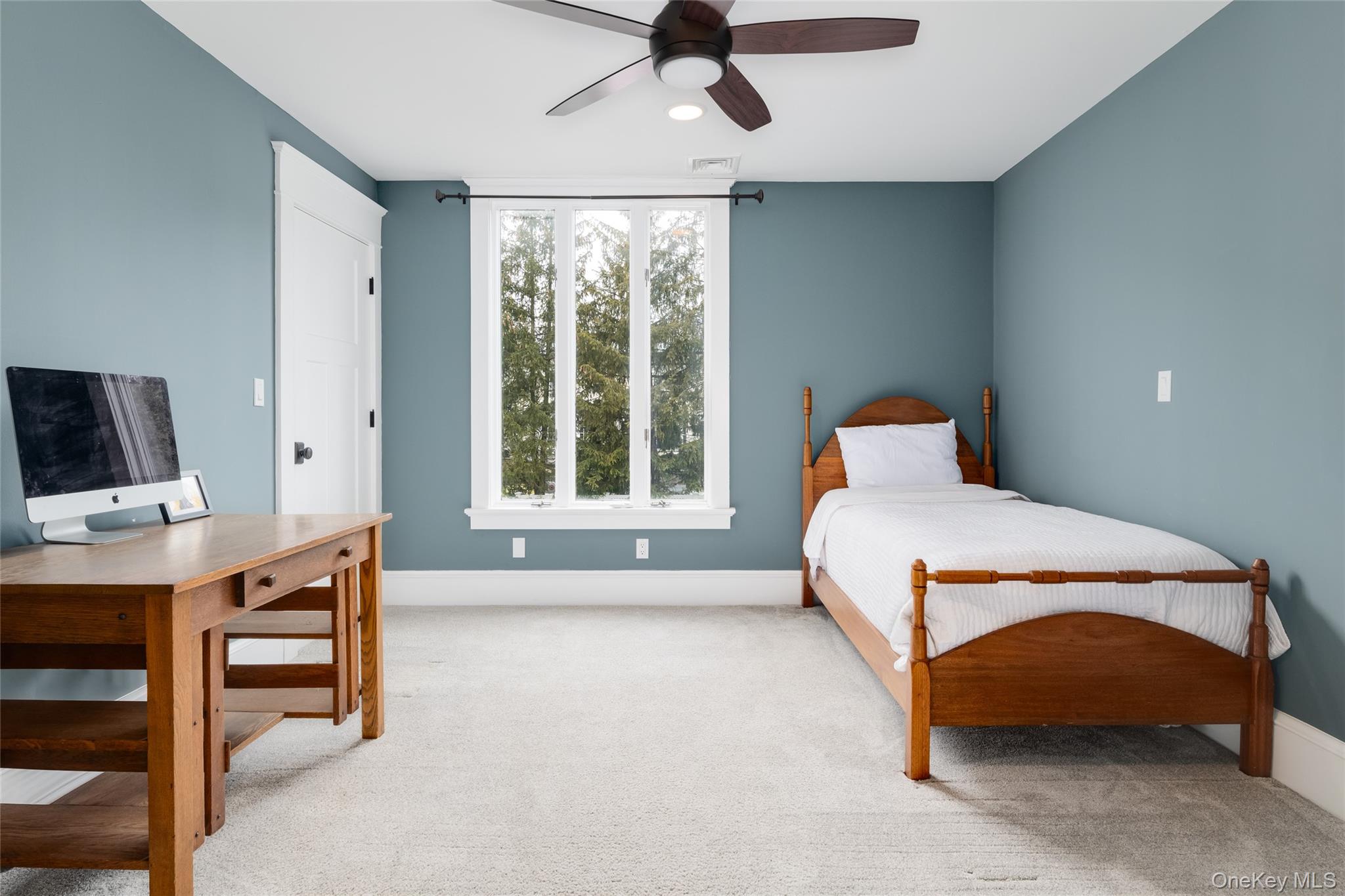 239 Sunny Ridge Road Harrison, NY 10528 - Photo 17 of 33 a bedroom with a bed and a window