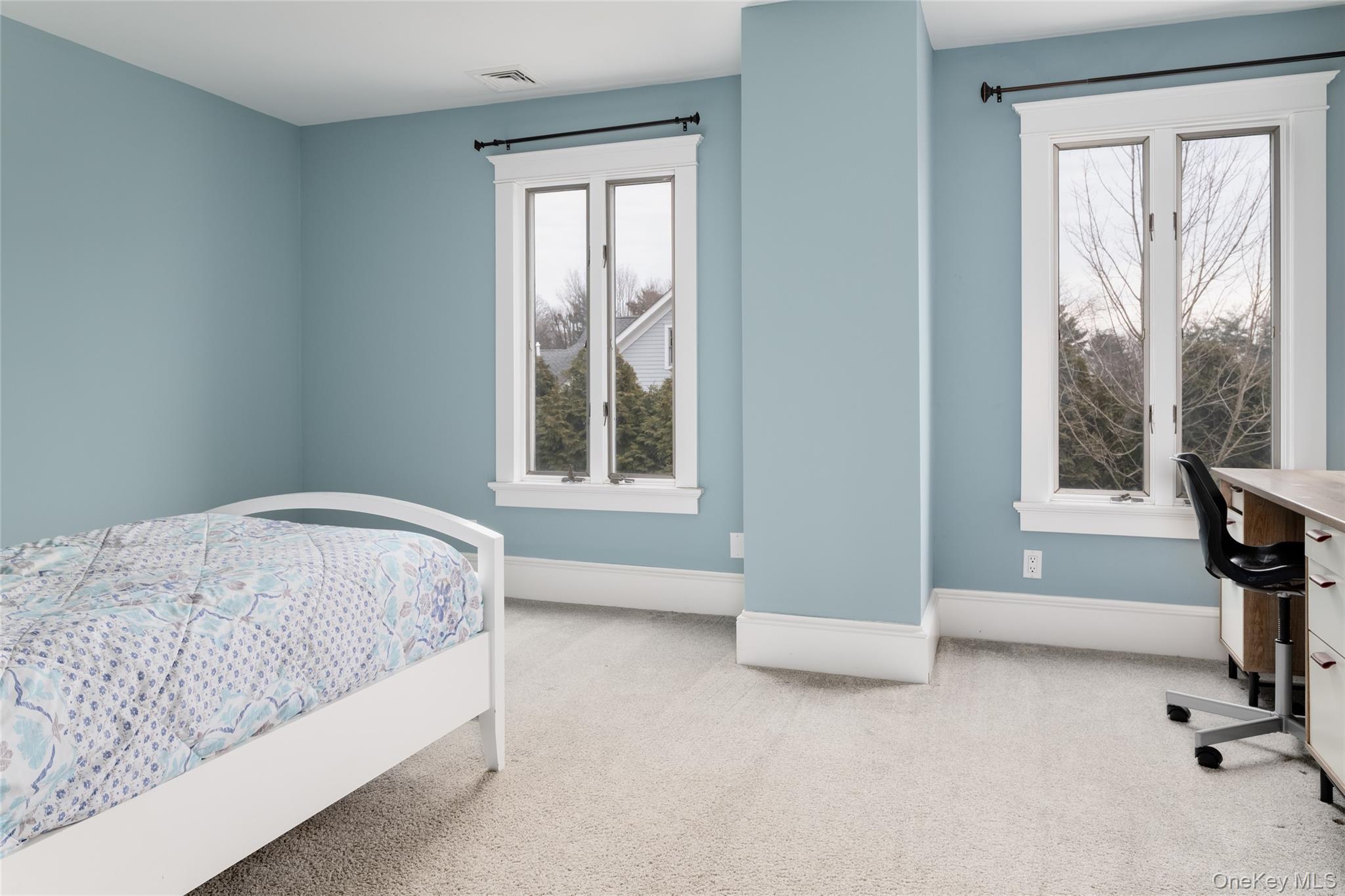 239 Sunny Ridge Road Harrison, NY 10528 - Photo 18 of 33 a bedroom with a bed and a window