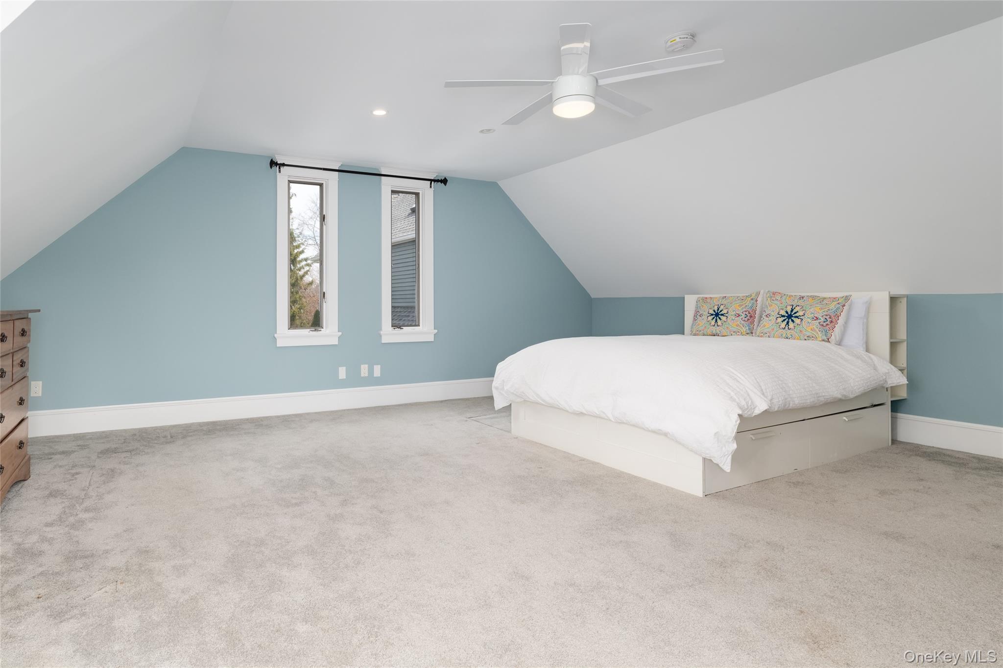 239 Sunny Ridge Road Harrison, NY 10528 - Photo 24 of 33 a bedroom with a bed and a window