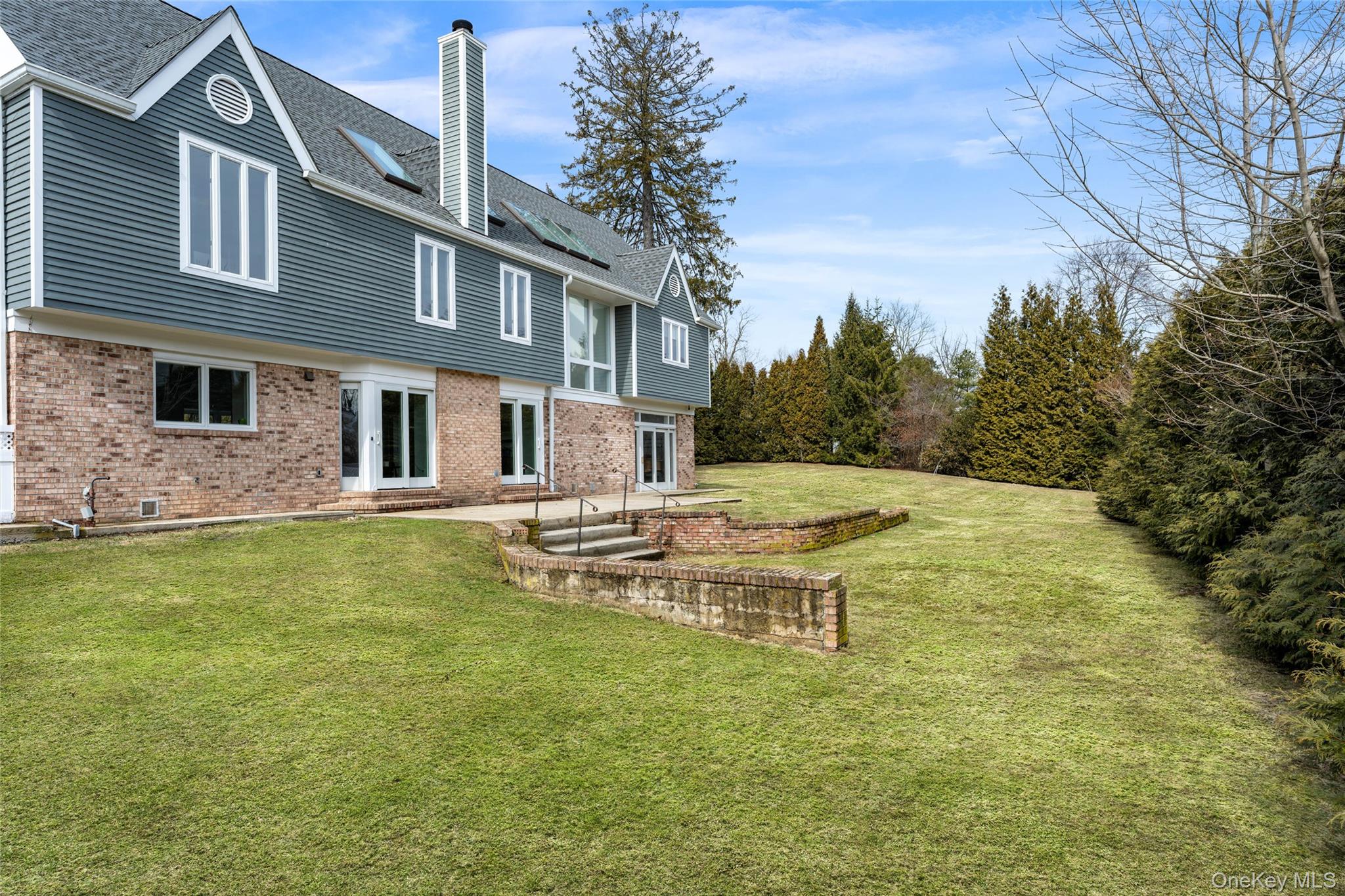 239 Sunny Ridge Road Harrison, NY 10528 - Photo 26 of 33 a view of a house with a swimming pool