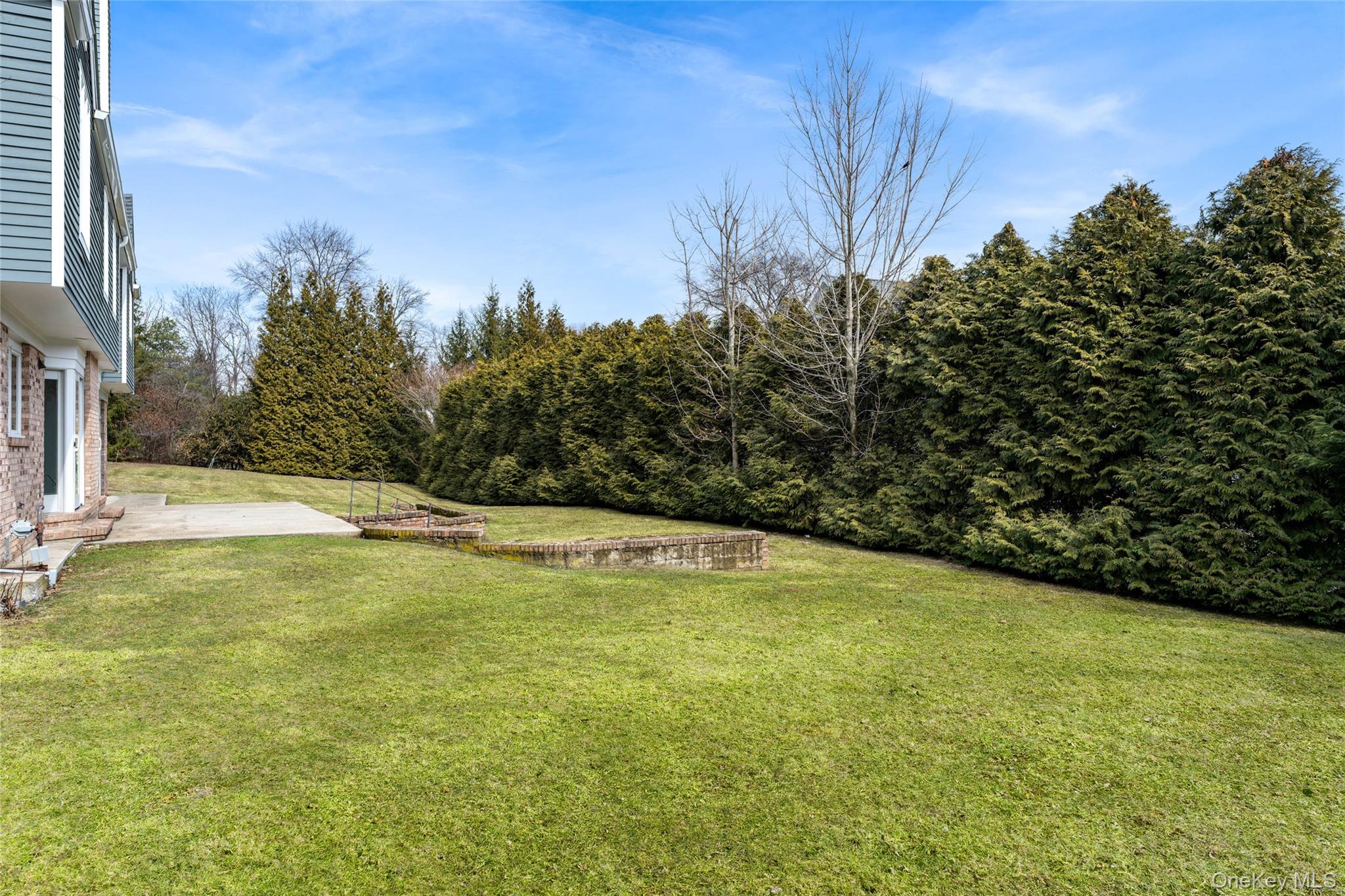 239 Sunny Ridge Road Harrison, NY 10528 - Photo 27 of 33 a view of a swimming pool with an outdoor space and seating area