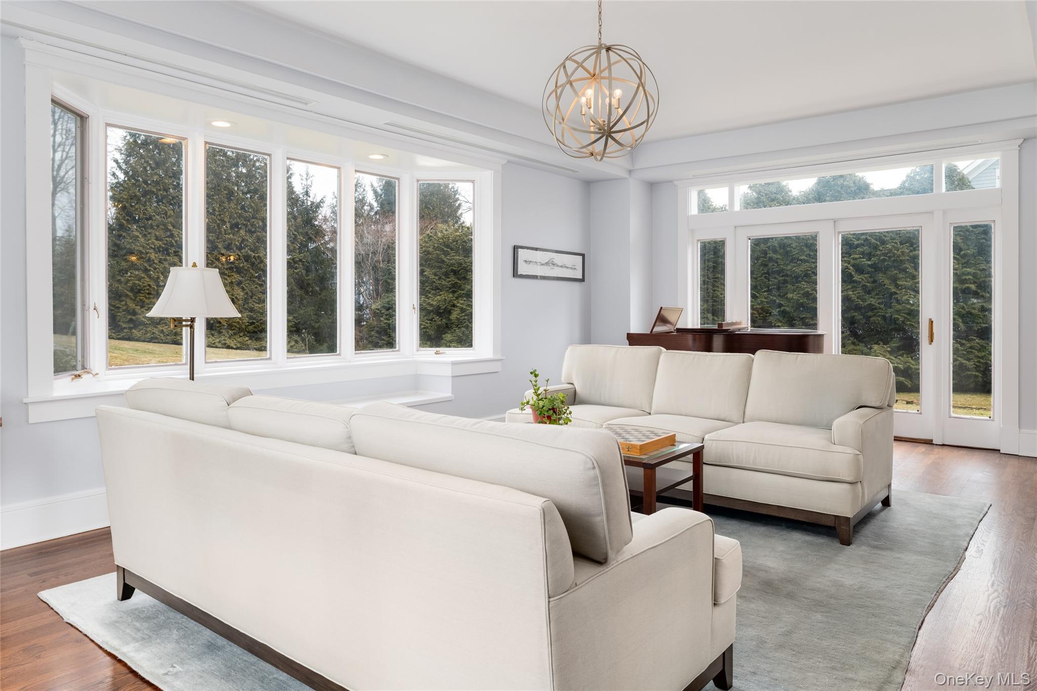 239 Sunny Ridge Road Harrison, NY 10528 - Photo 5 of 33 a living room with furniture and a large window
