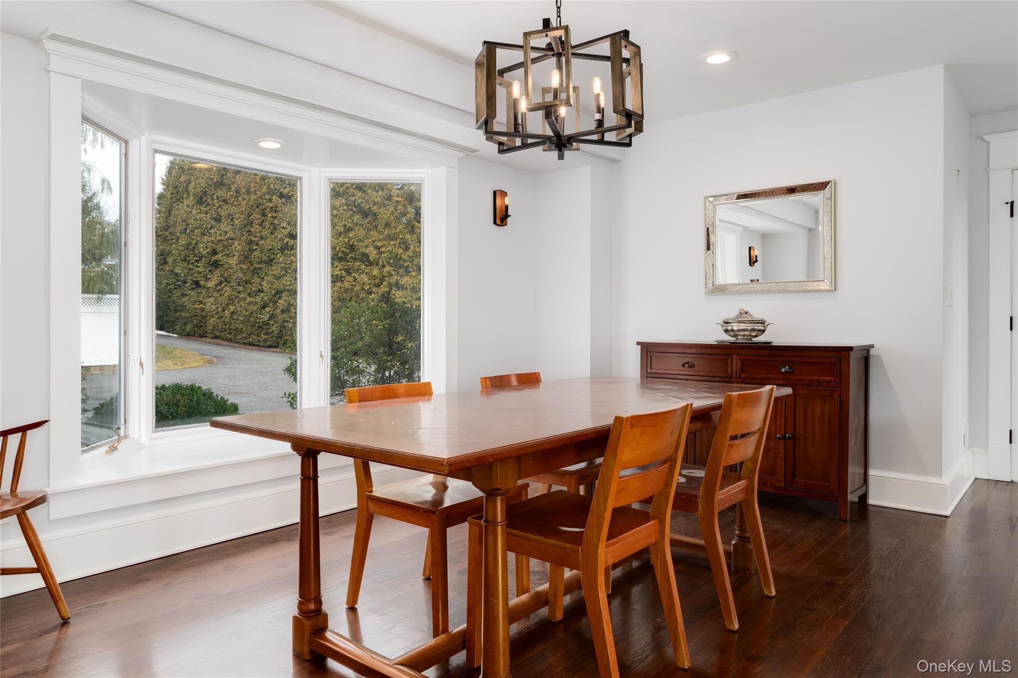 239 Sunny Ridge Road Harrison, NY 10528 - Photo 7 of 33 a view of a dining room with furniture window and wooden floor