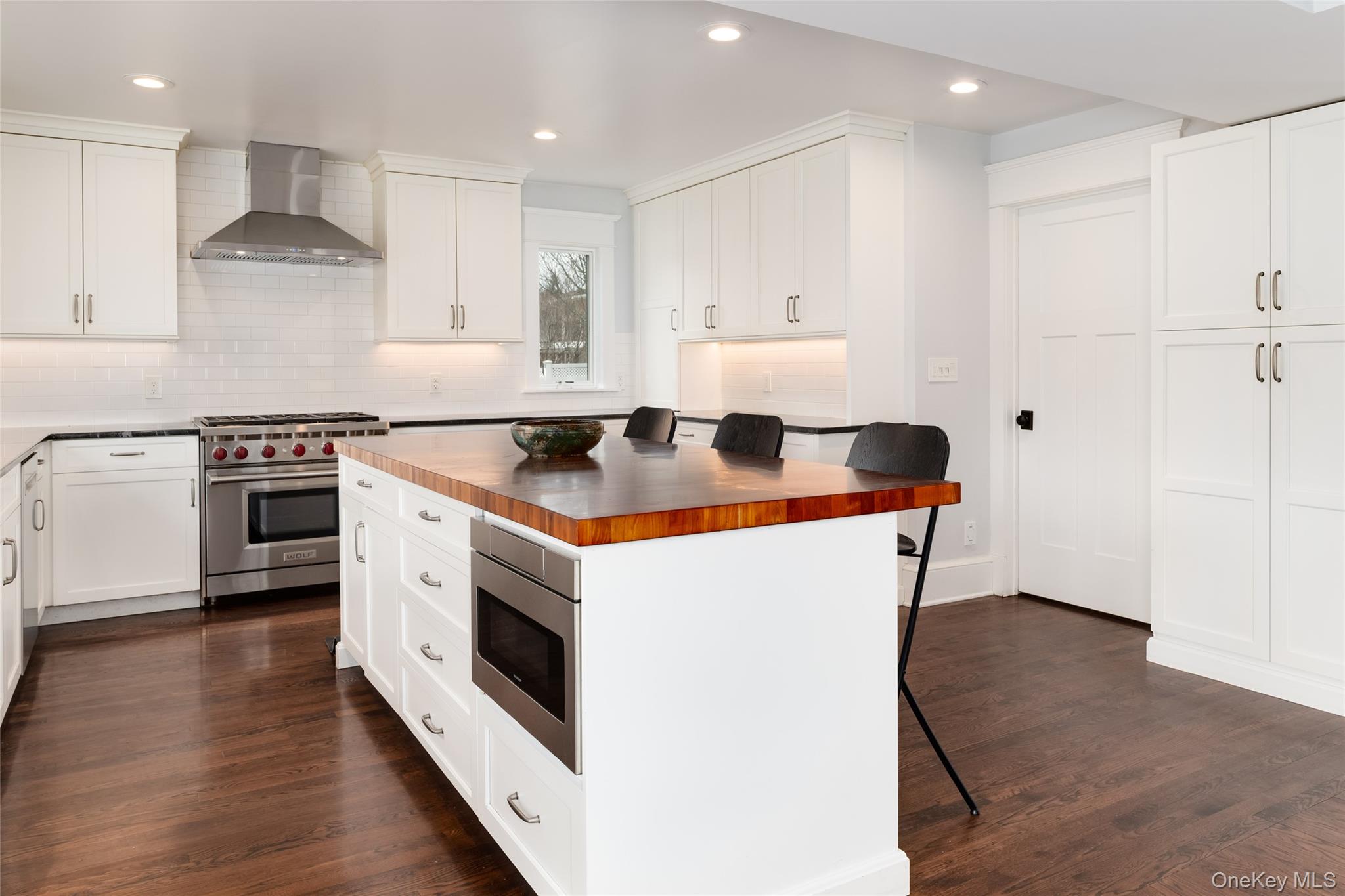 239 Sunny Ridge Road Harrison, NY 10528 - Photo 8 of 33 a kitchen with a stove and a sink