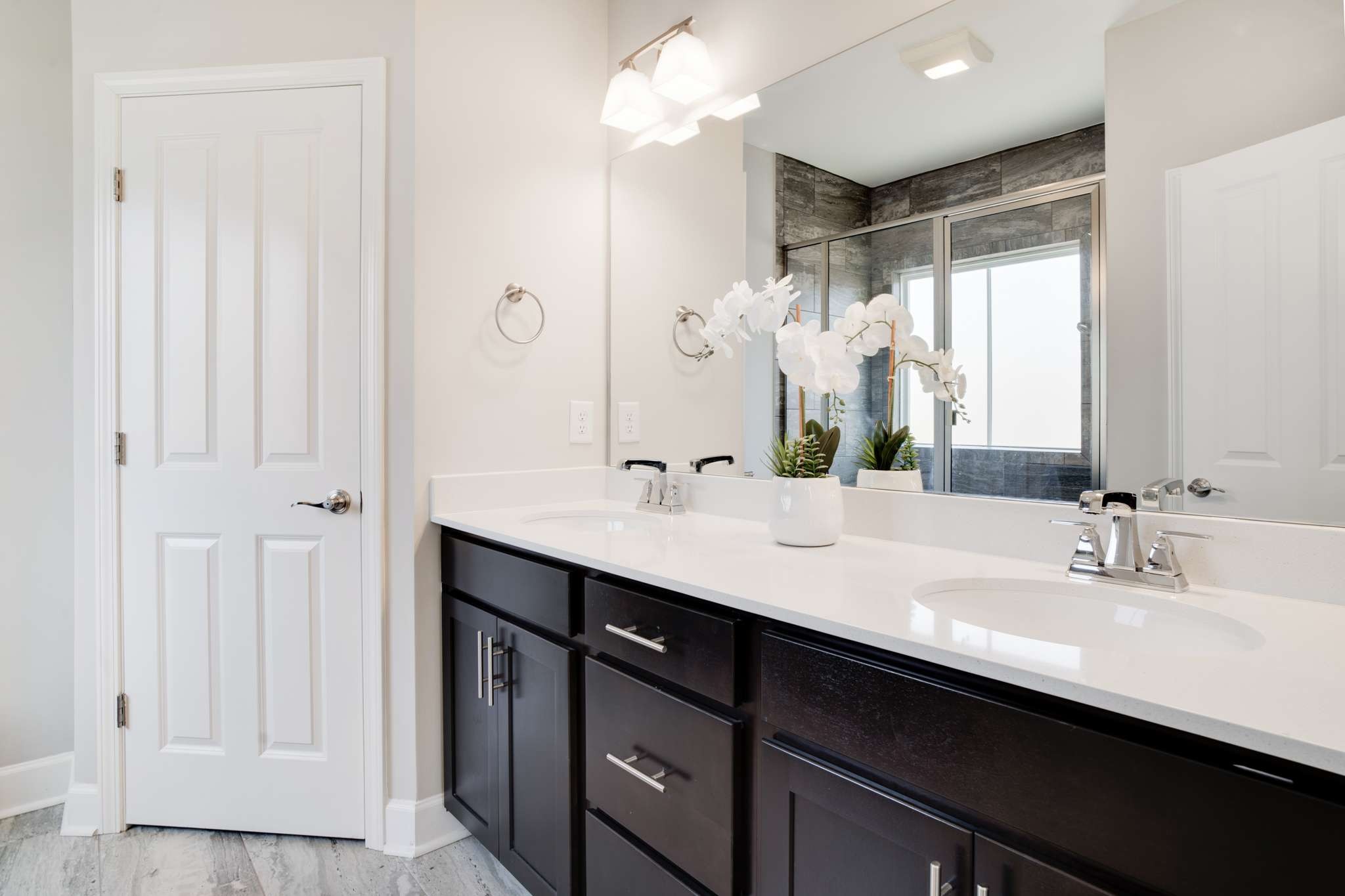 2001 Clement Street Nolensville, TN 37135 - Photo 12 of 22 a bathroom with a double vanity sink a mirror and a shower