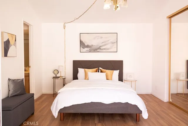 a bedroom with a bed and a couch