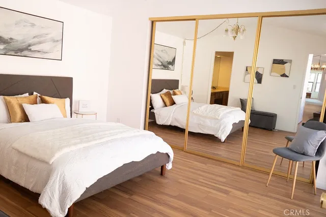 a bedroom with bed and window