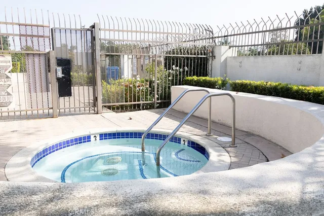 a view of a swimming pool with a patio