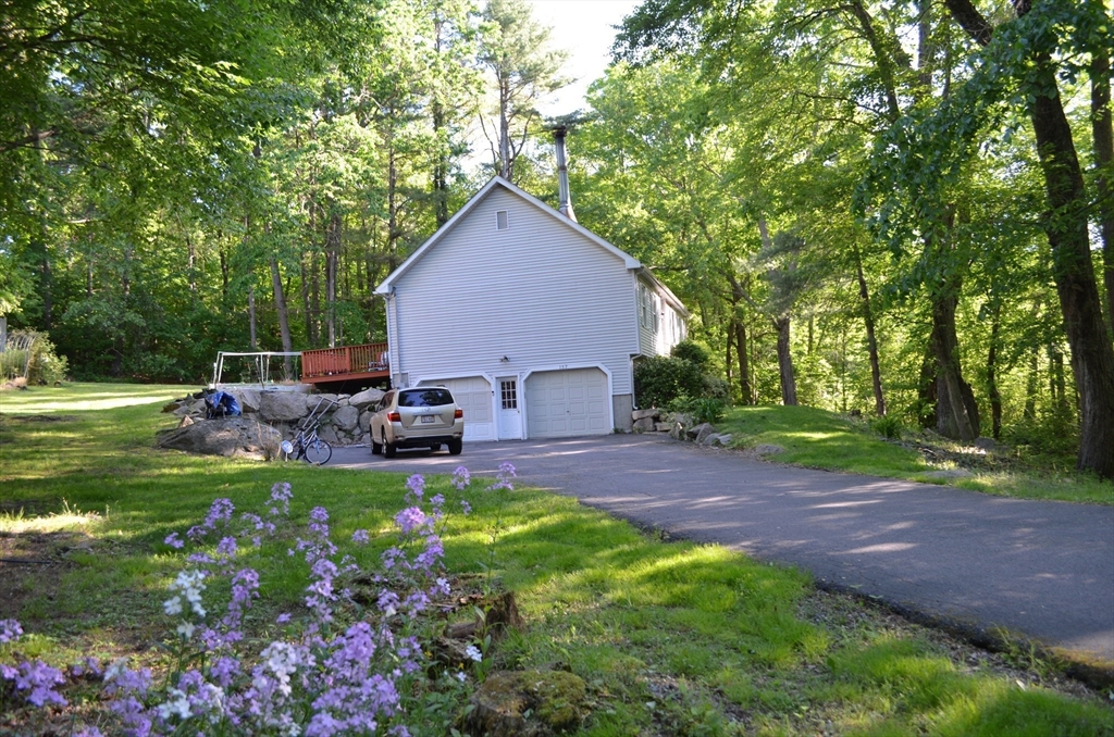 157 Southville Road Southborough, MA 01772 - Photo 12 of 13 a view of a backyard with plants and a garden