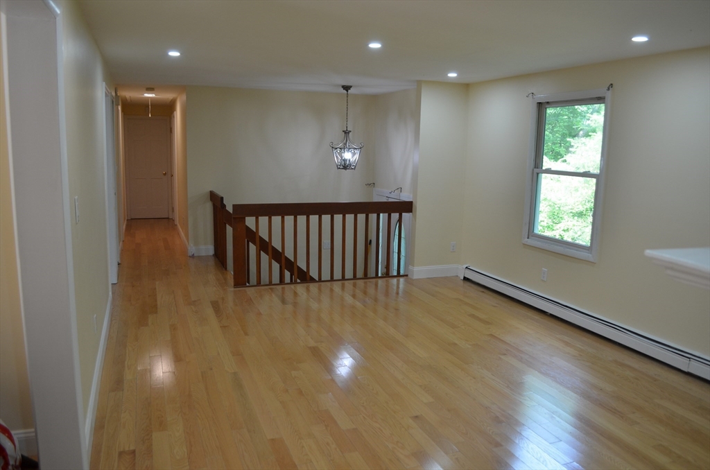 157 Southville Road Southborough, MA 01772 - Photo 4 of 13 an entryway in a hall with a window