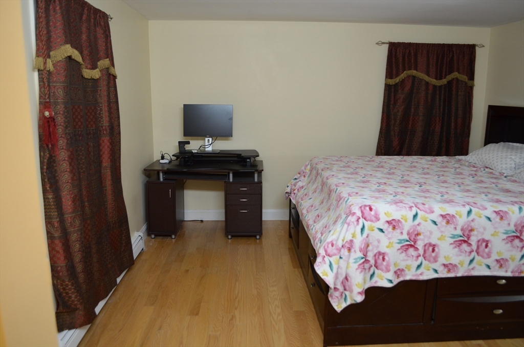 157 Southville Road Southborough, MA 01772 - Photo 8 of 13 a bedroom with a bed and a dresser