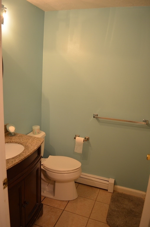 157 Southville Road Southborough, MA 01772 - Photo 10 of 13 a bathroom with a granite countertop toilet and a sink
