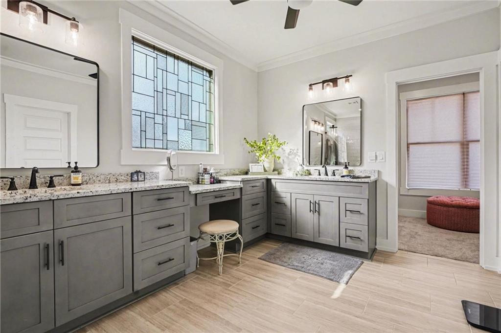 287 Conner Lane Williamson, GA 30292 - Photo 20 of 33 a bathroom with a double vanity sink a mirror and a bathtub