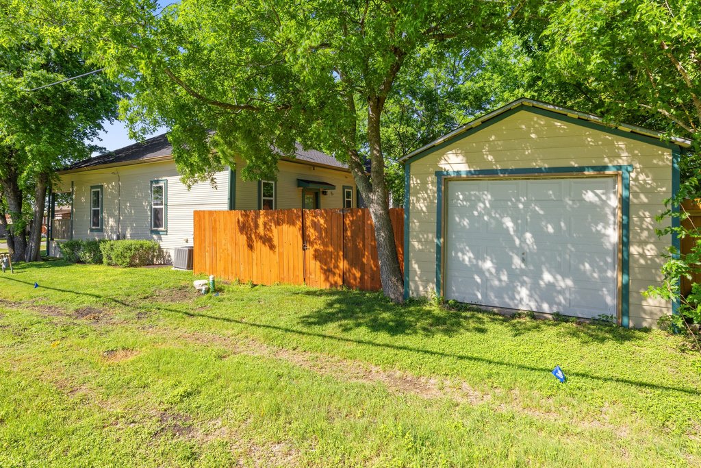 312 West 3rd Street Taylor, TX 76574 - Photo 18 of 33 a front view of house with yard and trees