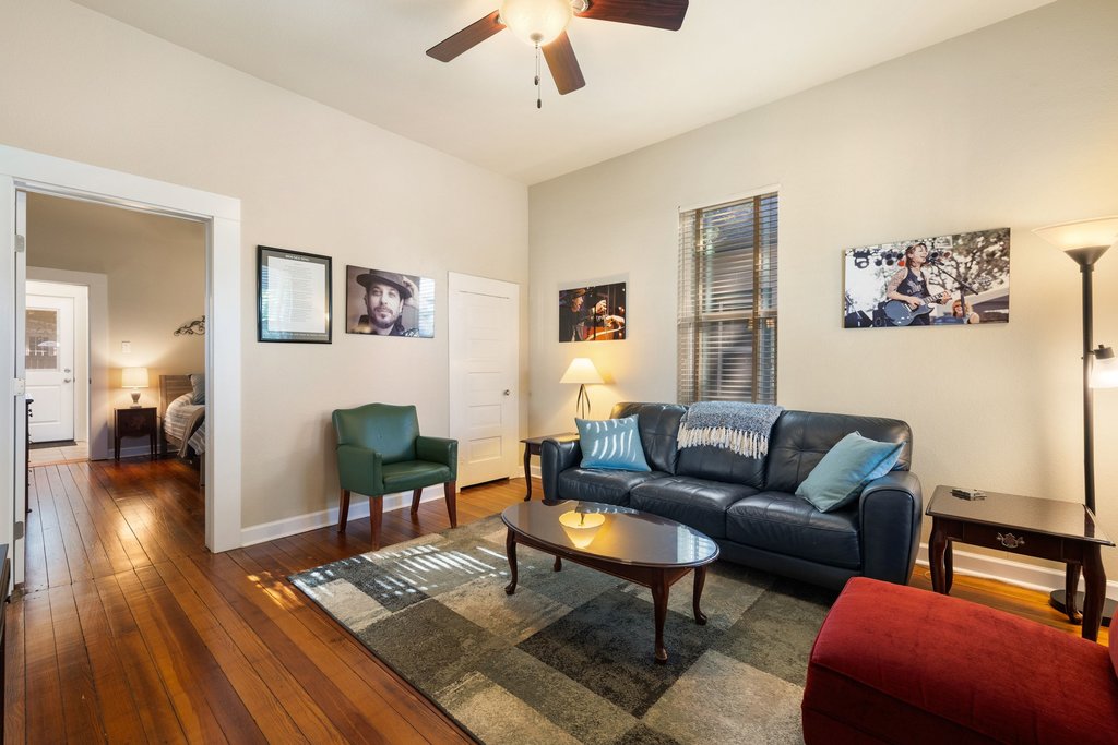 312 West 3rd Street Taylor, TX 76574 - Photo 21 of 33 a living room with furniture and a wooden floor