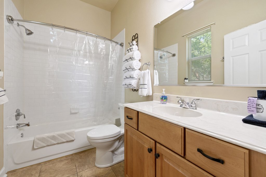 312 West 3rd Street Taylor, TX 76574 - Photo 27 of 33 a bathroom with a sink a toilet and shower