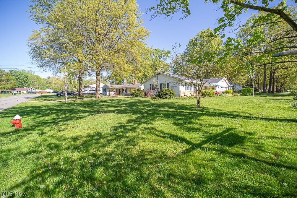 495 High Meadow Road Amherst, OH 44001 - Photo 7 of 39 Front yard looking from the corner of Rock Creek Run & High Meadow.