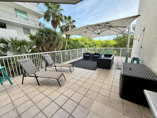 a view of roof deck with furniture
