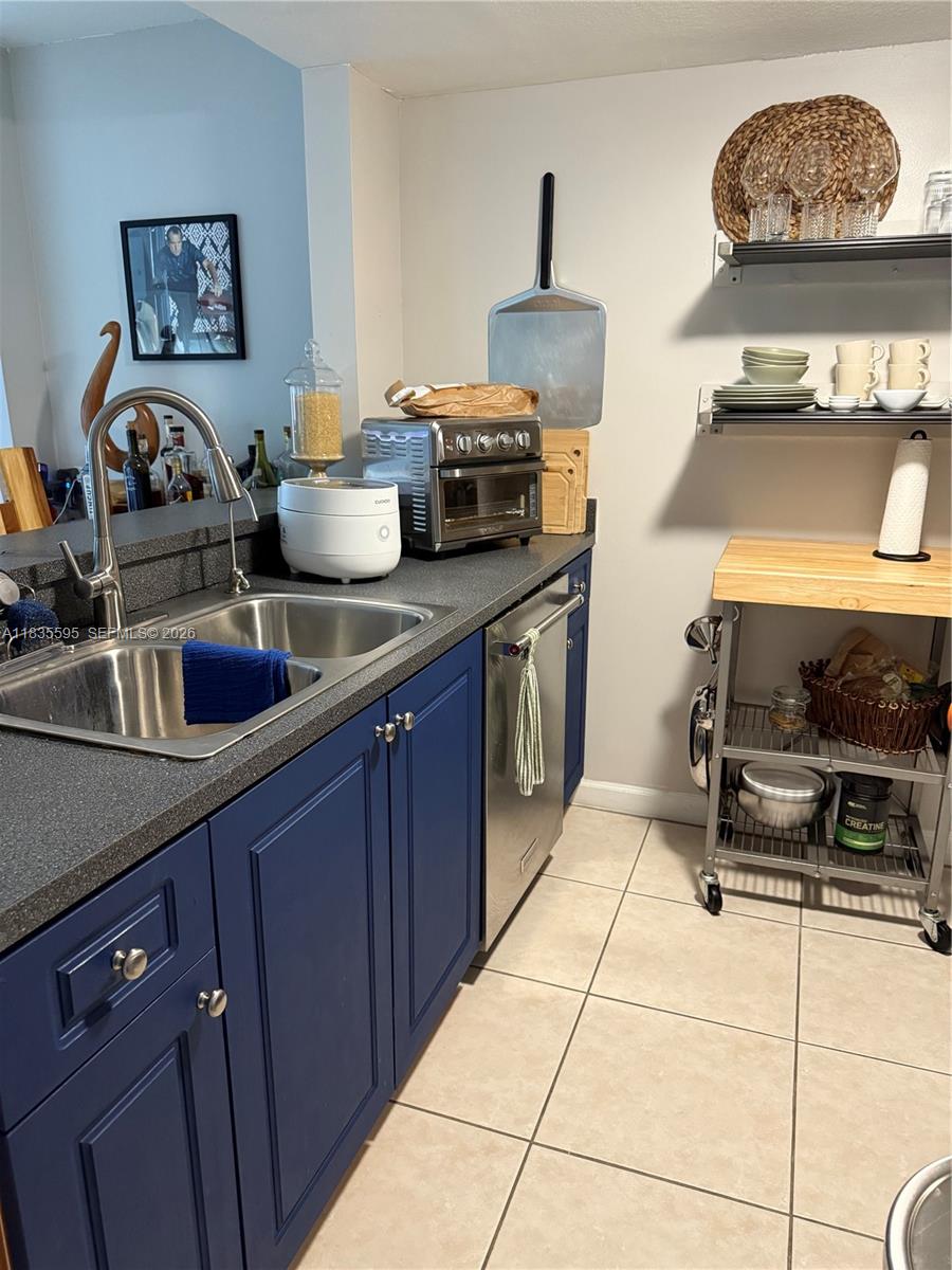 280 Southwest 20th Road, Unit 404 Miami, FL 33129 - Photo 12 of 19 a kitchen with a sink and cabinets