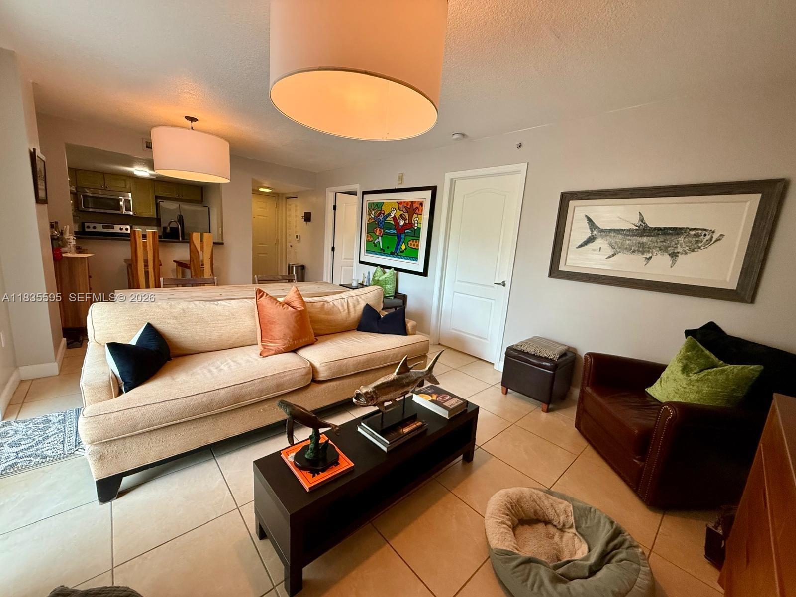 280 Southwest 20th Road, Unit 404 Miami, FL 33129 - Photo 16 of 19 a living room with furniture and a lamp