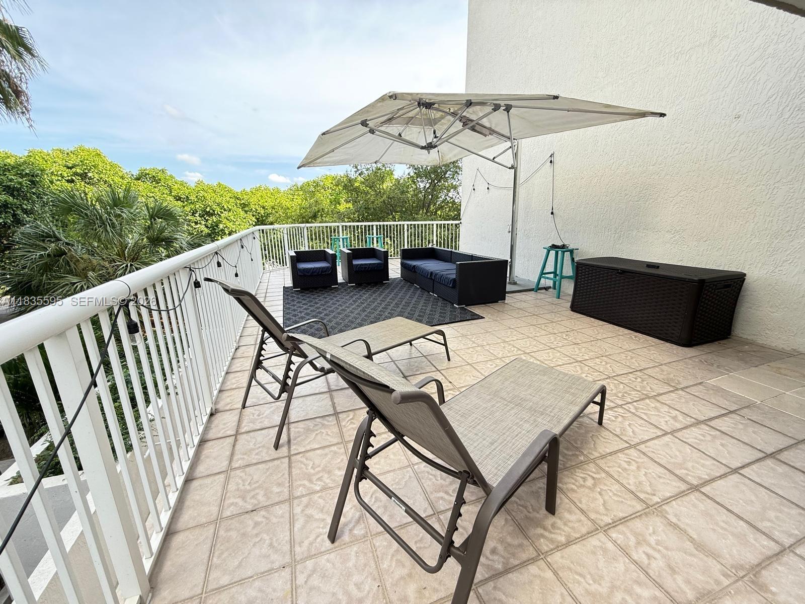 280 Southwest 20th Road, Unit 404 Miami, FL 33129 - Photo 18 of 19 a view of balcony with furniture