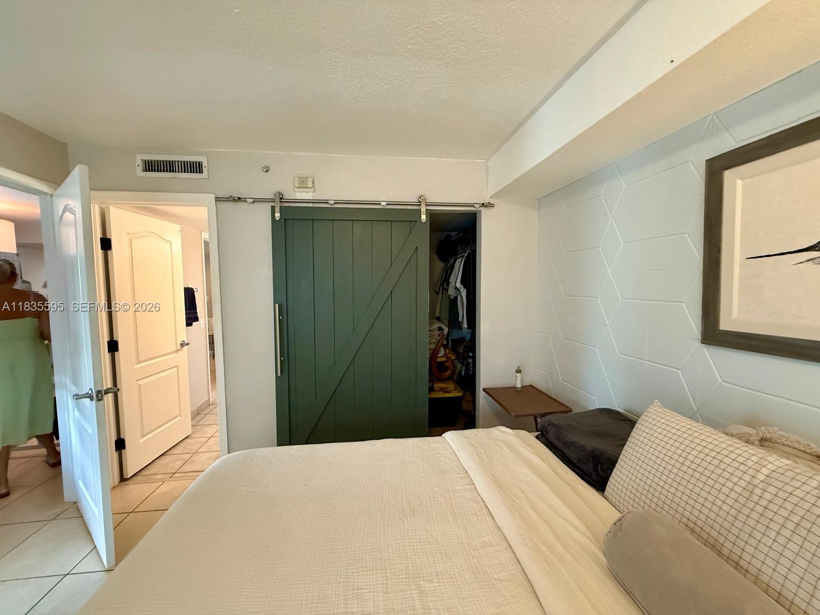 280 Southwest 20th Road, Unit 404 Miami, FL 33129 - Photo 6 of 19 a bedroom with a bed and a window