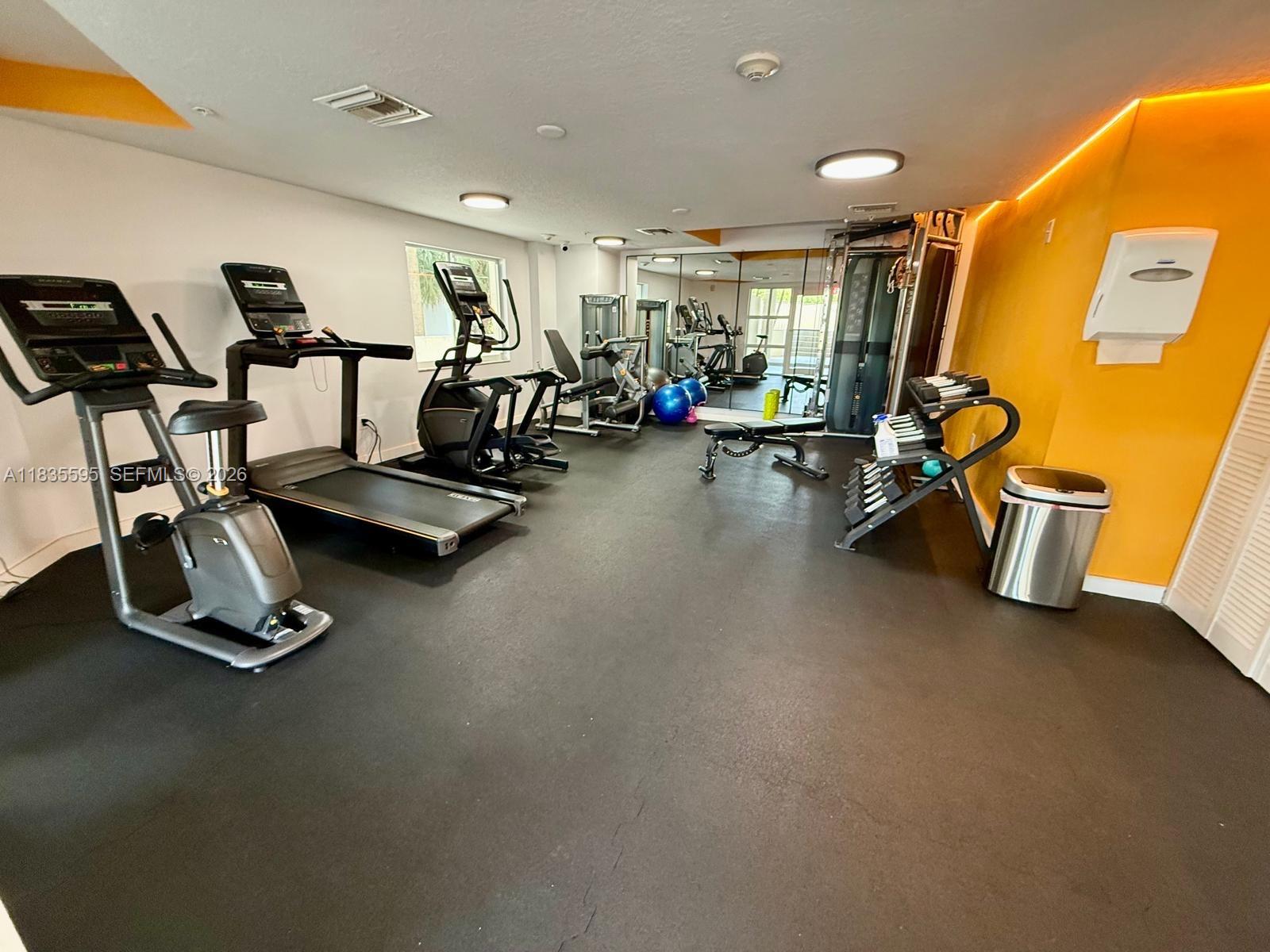 280 Southwest 20th Road, Unit 404 Miami, FL 33129 - Photo 8 of 19 a view of a room with gym equipment