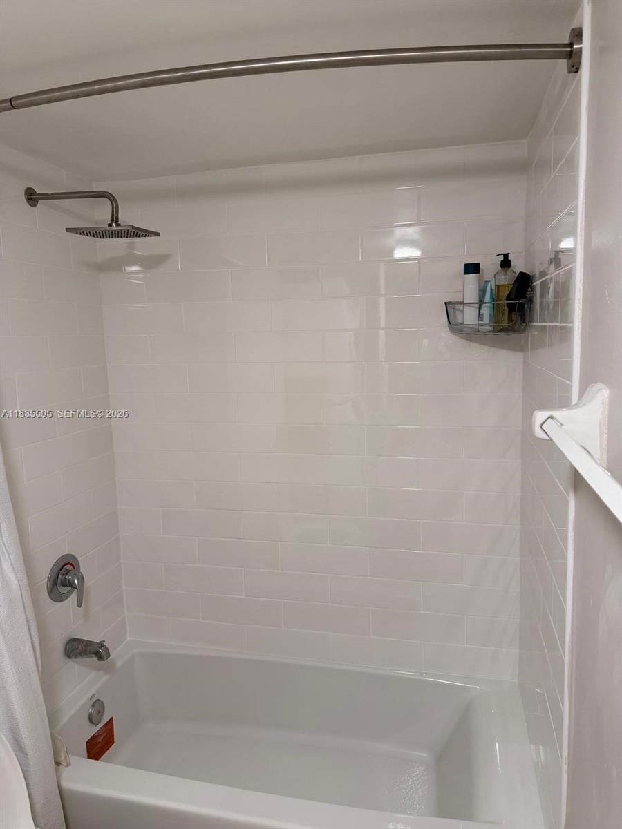 280 Southwest 20th Road, Unit 404 Miami, FL 33129 - Photo 10 of 19 a bathroom with a bathtub