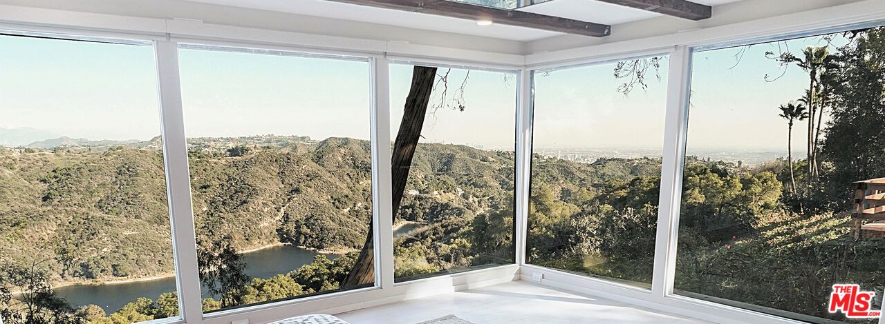 2270 Stradella Road Los Angeles, CA 90077 - Photo 11 of 29 a view of a glass door and a window