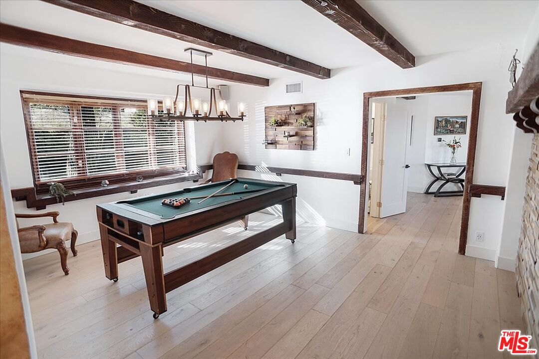 2270 Stradella Road Los Angeles, CA 90077 - Photo 16 of 29 a living room with furniture pool table and a large window